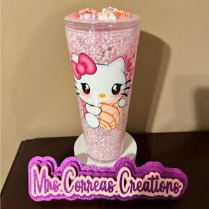 Hello Kitty concha snowglobe